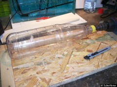 Flasche in Schneidvorrichtung