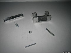 Einzelteile des Auslösers